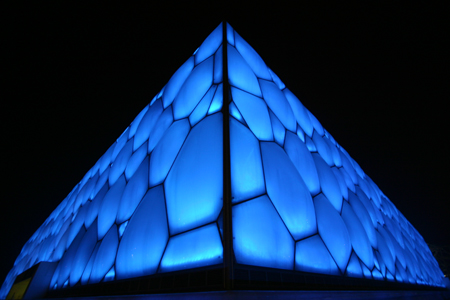 Beijing The National Aquatics Center illuminated at night.