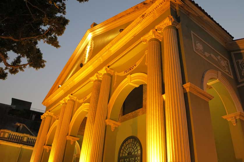 The exterior of the theater at night.