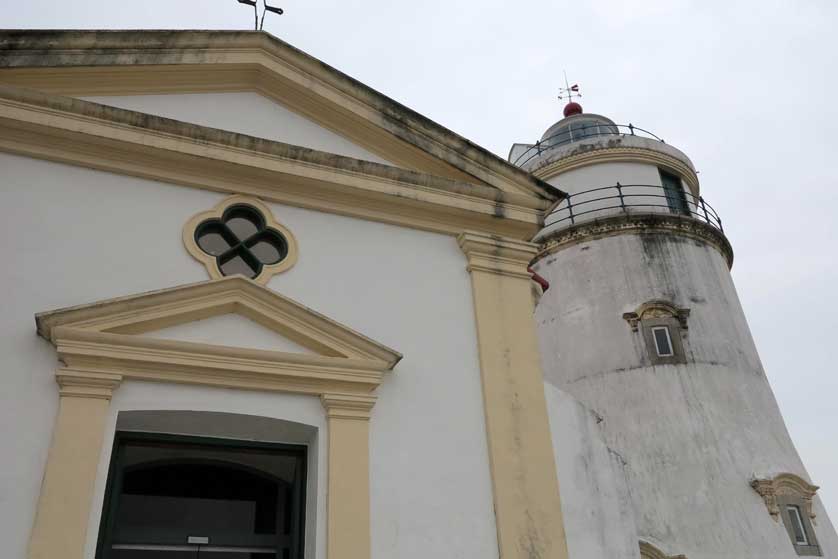 The chapel and lighthouse stand within Guia Fortress.