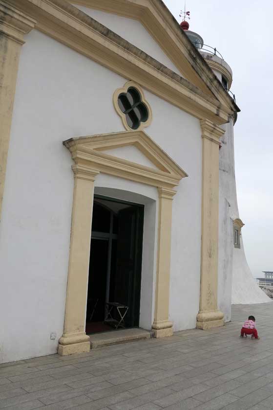 The chapel and lighthouse stand within Guia Fortress.