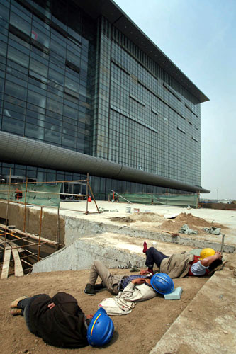Olympic Workers resting, Athletes Village, Beijing, China.