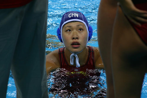 Water polo player at Ying Tung Natatorium, Beijing, China.