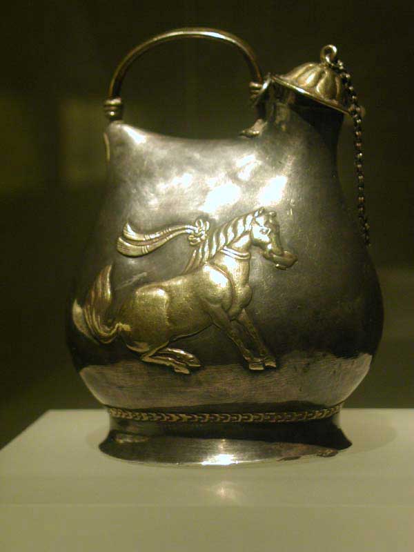 Gilt silver jar with patterns of dancing horses.